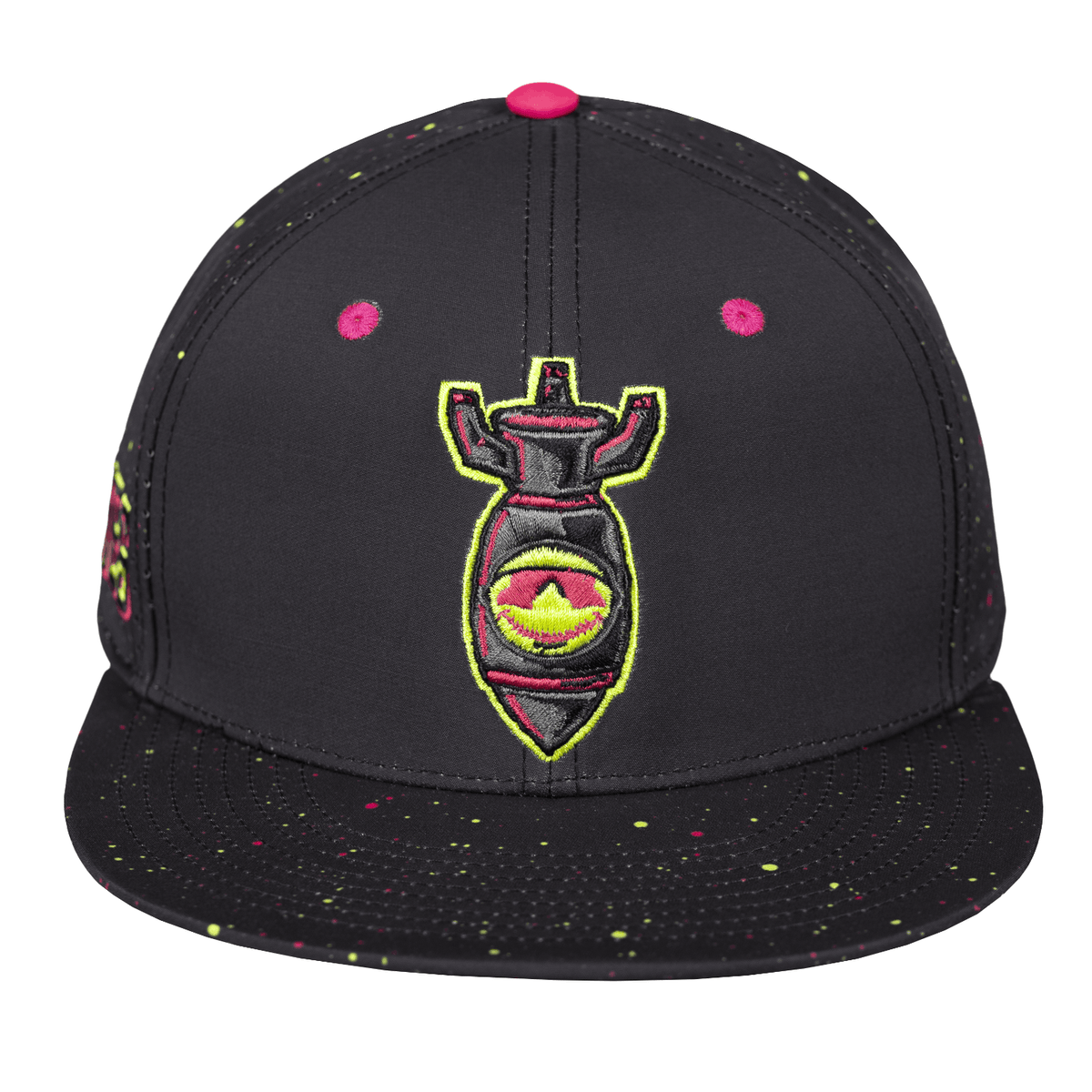 A black snapback baseball lifestyle cap with a flat brim, featuring a central embroidered graphic of a Nukes bomb with pink, yellow, and green details. The cap has pink snapback buttons and multicolor paint splatter details on the front panels and brim.