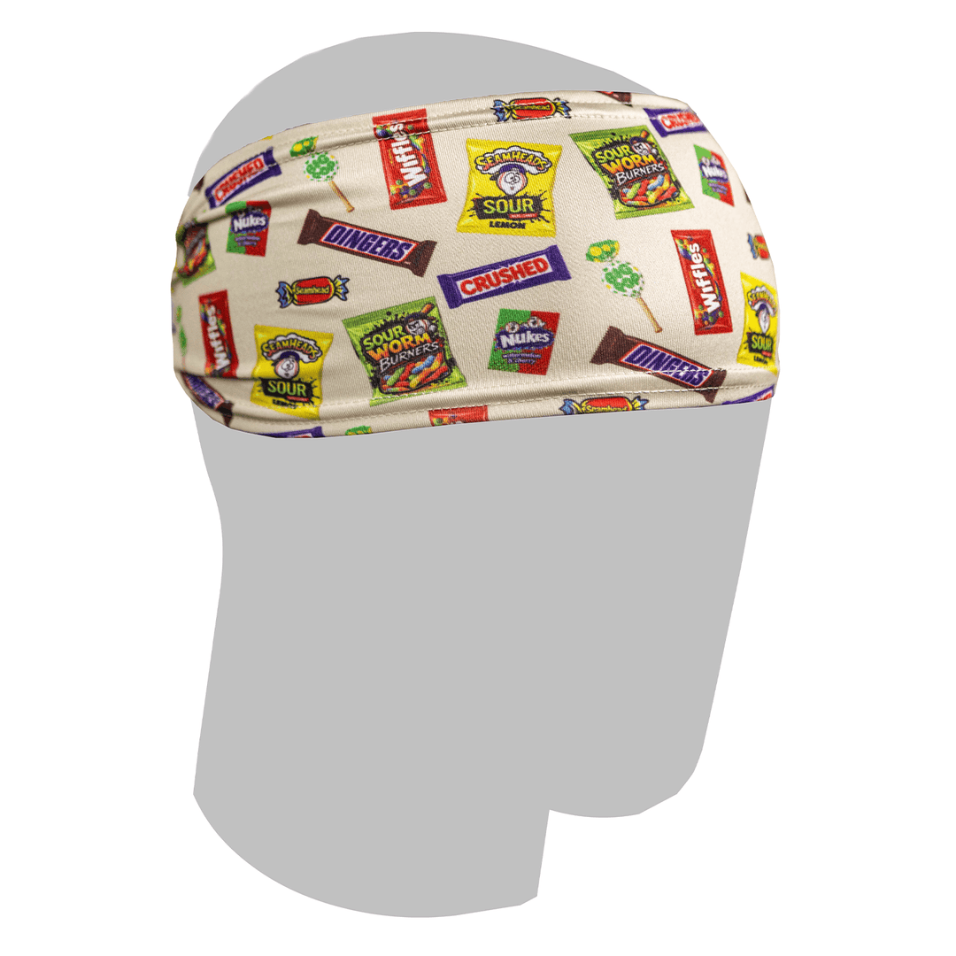 A cream fabric Halloween Baseball 101 headband featuring a colorful baseball inspired candy and snack logo print.